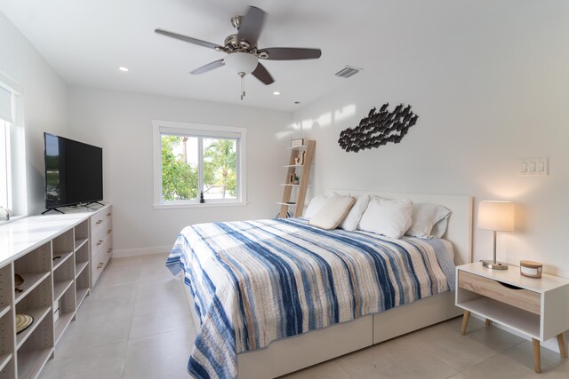 bedroom featuring ceiling fan and light tile patterned floors