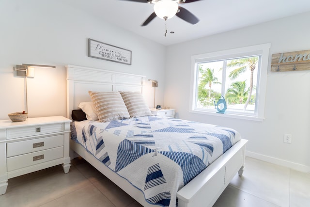 tiled bedroom with ceiling fan