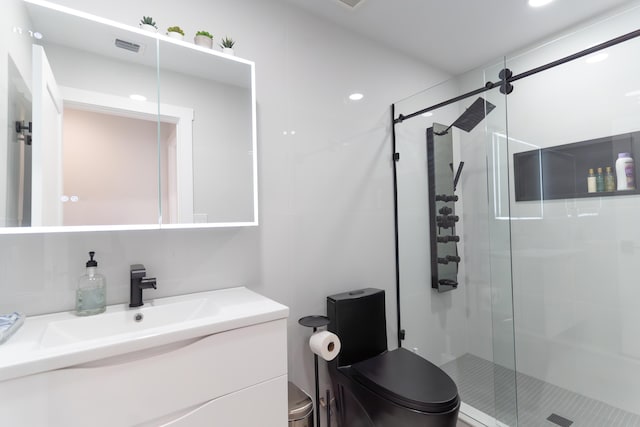 bathroom featuring walk in shower, vanity, and toilet