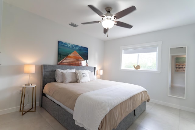 bedroom featuring light tile patterned floors and ceiling fan