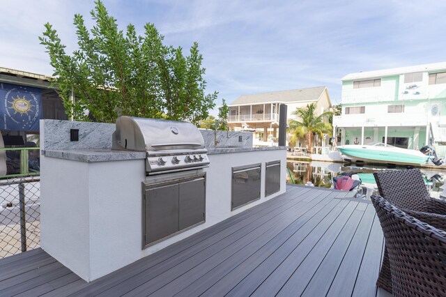 wooden deck featuring area for grilling and grilling area