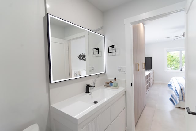 bathroom featuring ceiling fan, tile patterned floors, and vanity