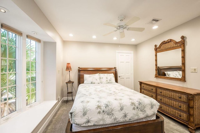 bedroom with light carpet and ceiling fan