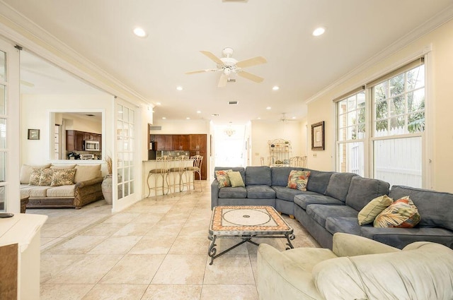 tiled living room featuring french doors, ceiling fan, and ornamental molding