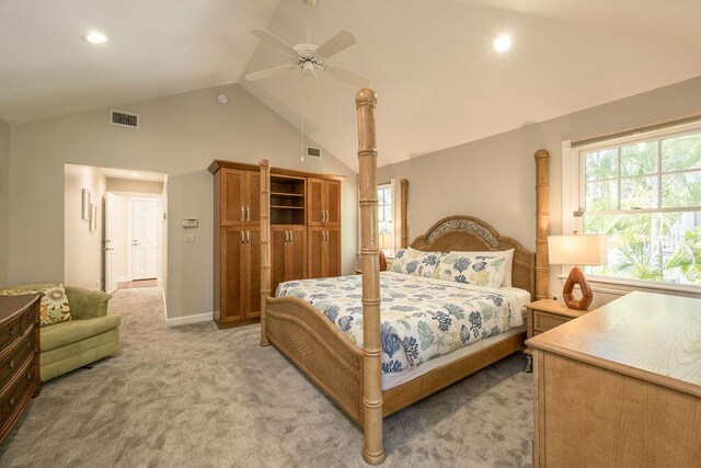 carpeted bedroom with ceiling fan and lofted ceiling