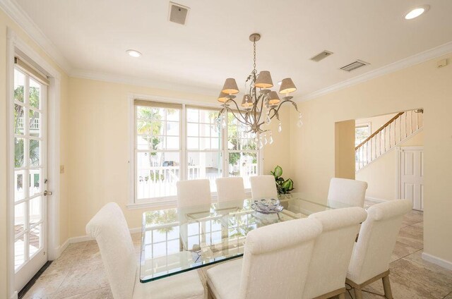 dining area featuring crown molding, light tile patterned floors, and an inviting chandelier