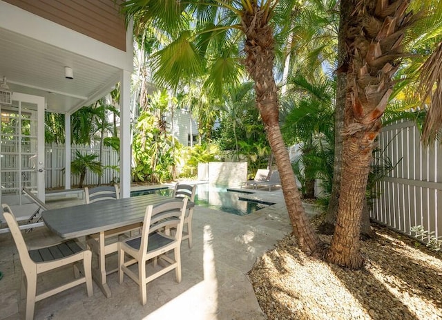 view of patio / terrace featuring a fenced in pool