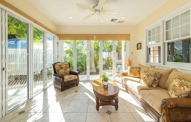 sunroom / solarium featuring ceiling fan