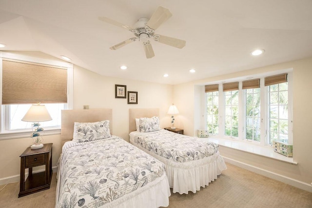 bedroom featuring light colored carpet and ceiling fan