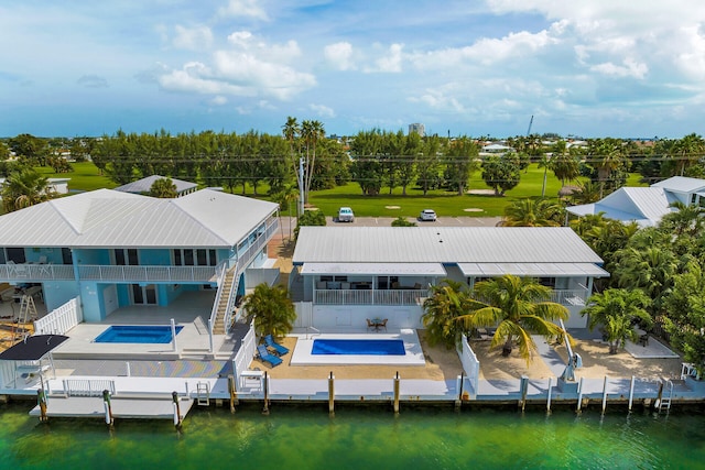 drone / aerial view featuring a water view