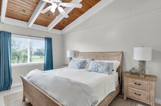 tiled bedroom featuring wood ceiling, ceiling fan, and vaulted ceiling with beams