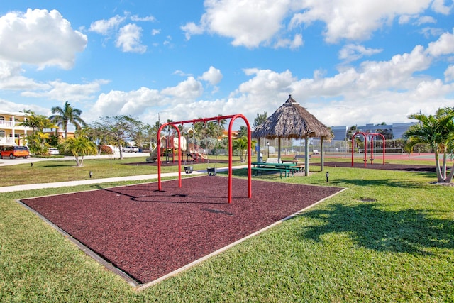 view of playground with a gazebo and a lawn