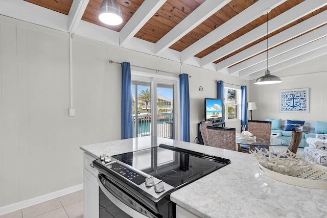 kitchen with pendant lighting, white cabinetry, lofted ceiling with beams, light tile patterned flooring, and stainless steel range with electric cooktop