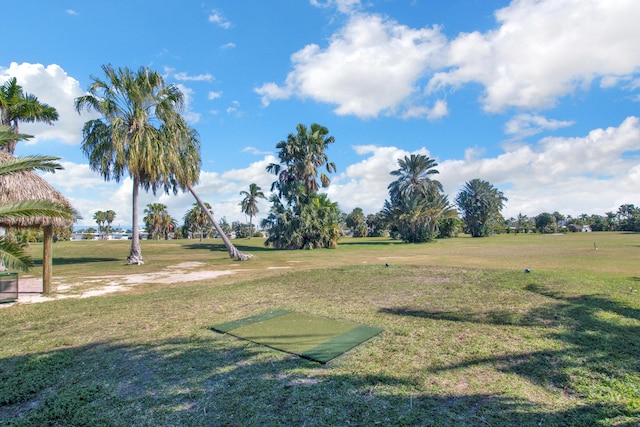 surrounding community featuring a lawn