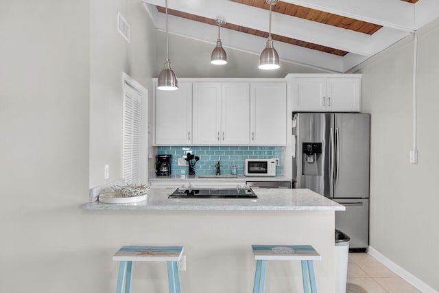 kitchen featuring stainless steel refrigerator with ice dispenser, tasteful backsplash, white cabinets, light tile patterned flooring, and kitchen peninsula