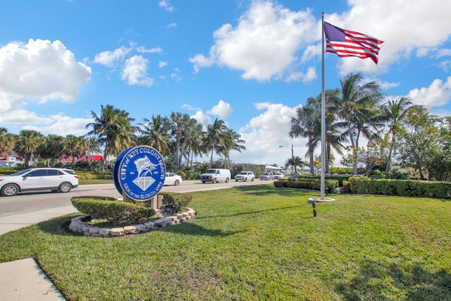 view of home's community with a yard