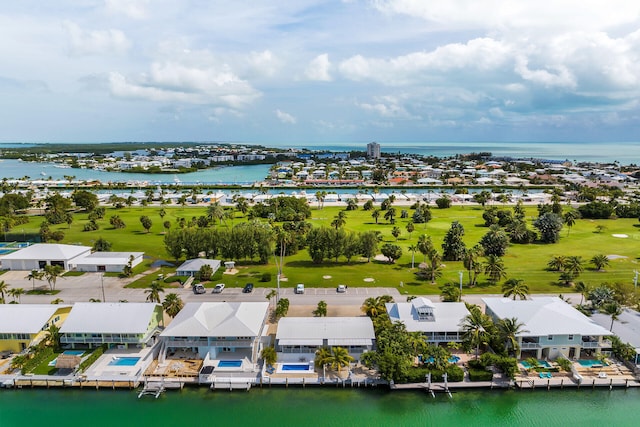 birds eye view of property with a water view