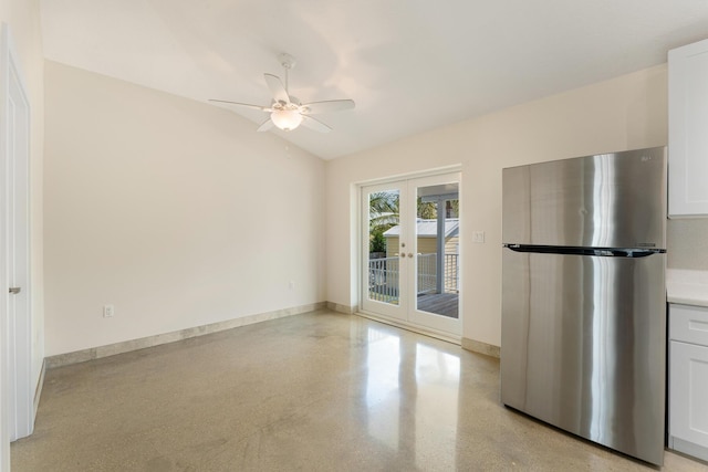 129 Tavern Dr, Tavernier, FL 33070 - kitchen with freestanding refrigerator, french doors, a ceiling fan, vaulted ceiling, and baseboards