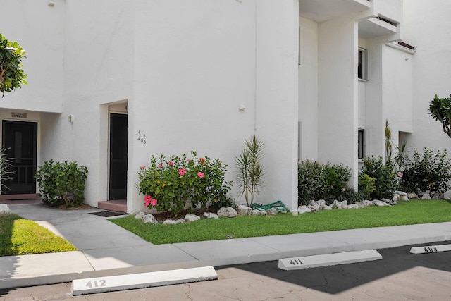 601 W Ocean Dr Unit 411C, Key Colony, FL 33051 - view of building exterior with uncovered parking