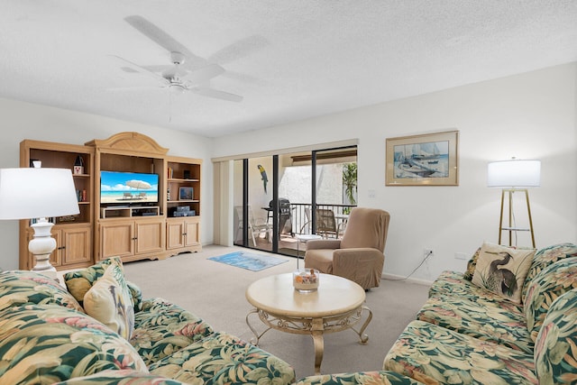 601 W Ocean Dr Unit 411C, Key Colony, FL 33051 - living room featuring light colored carpet, ceiling fan, a textured ceiling, and baseboards