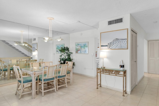 601 W Ocean Dr Unit 411C, Key Colony, FL 33051 - dining space featuring a ceiling fan, baseboards, and stairway