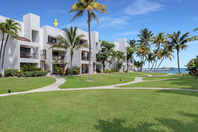 601 W Ocean Dr Unit 411C, Key Colony, FL 33051 - view of community with a water view and a lawn