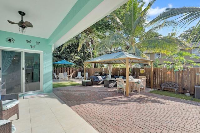 view of patio with ceiling fan and an outdoor living space