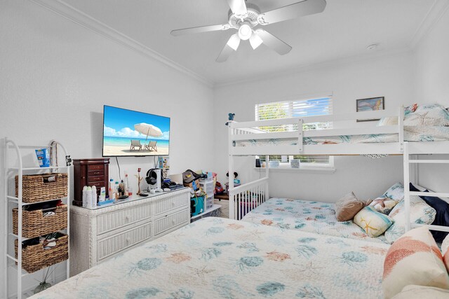 bedroom with ceiling fan and ornamental molding