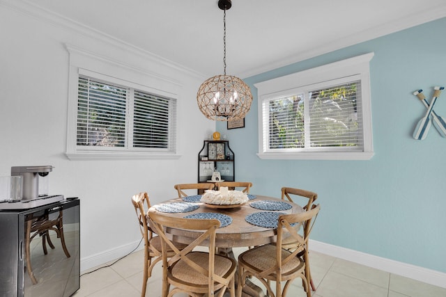 tiled dining space with ornamental molding and a chandelier