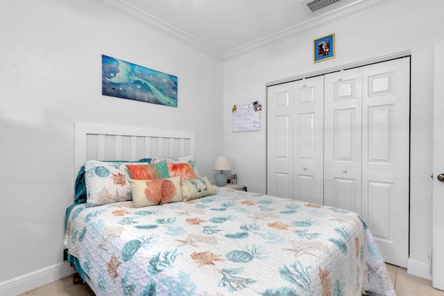 bedroom featuring ornamental molding and a closet