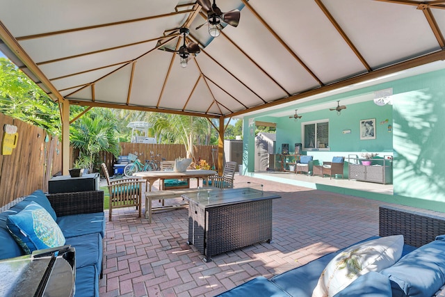 view of patio / terrace with a gazebo, an outdoor hangout area, and ceiling fan