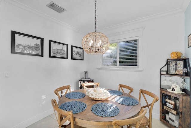 dining area featuring crown molding, an inviting chandelier, and light tile patterned floors