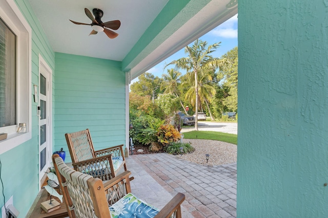 view of patio featuring ceiling fan