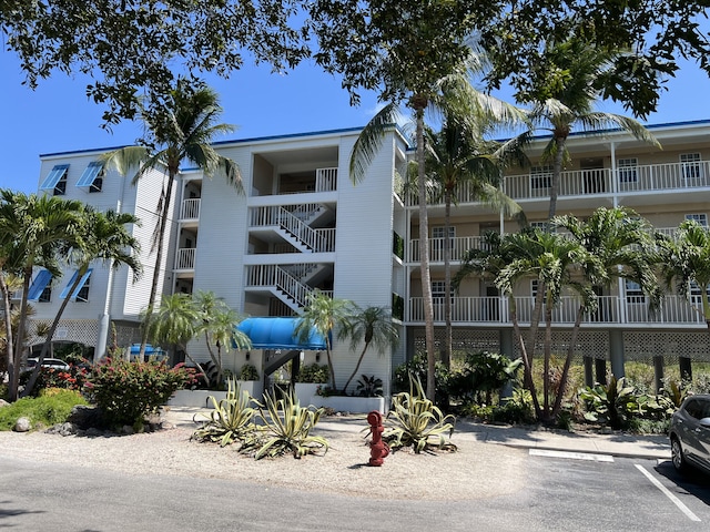 view of property featuring uncovered parking