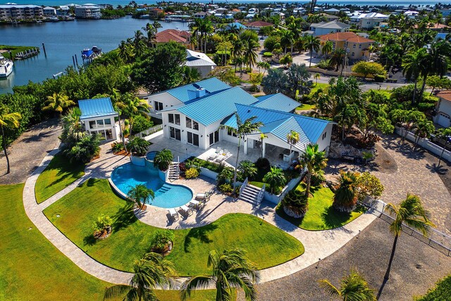 birds eye view of property with a water view