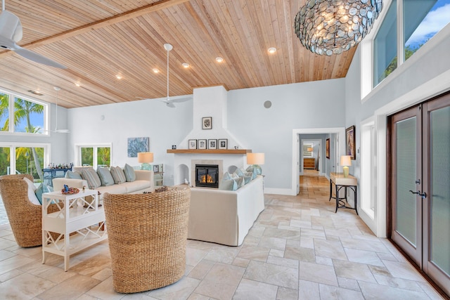 living room featuring a high ceiling, a large fireplace, wooden ceiling, and french doors