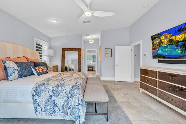 bedroom with multiple windows, vaulted ceiling, and ceiling fan