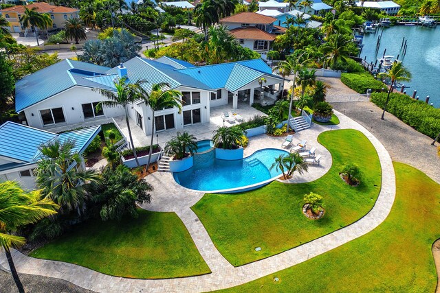 birds eye view of property featuring a water view