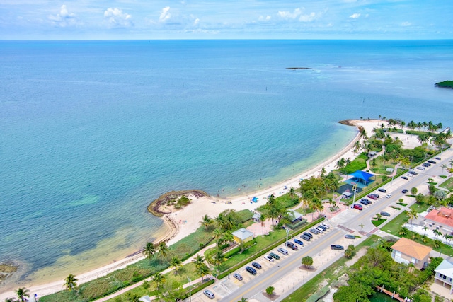 aerial view with a water view and a beach view