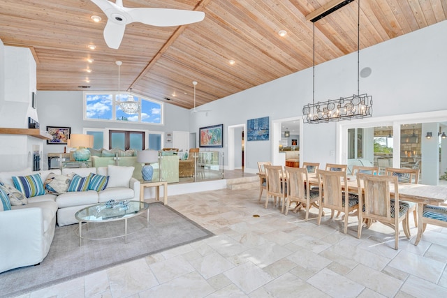 living room with wood ceiling, ceiling fan with notable chandelier, and high vaulted ceiling