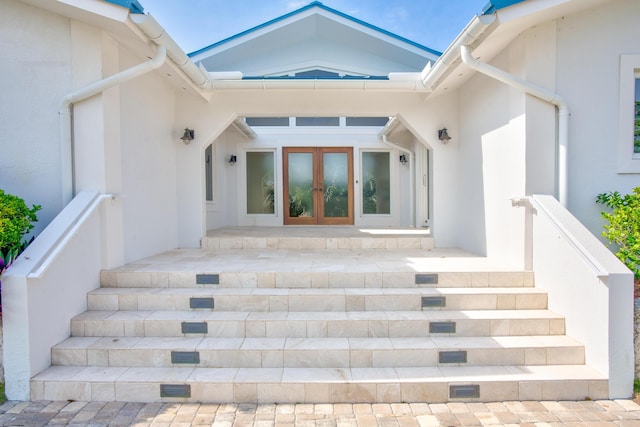 view of exterior entry featuring french doors