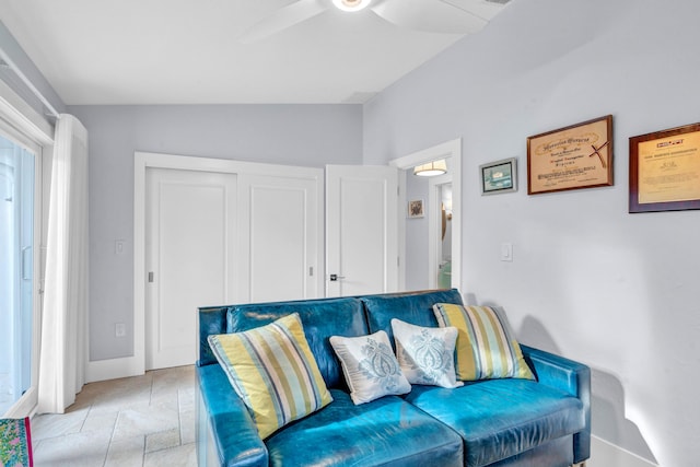 living room with vaulted ceiling and ceiling fan