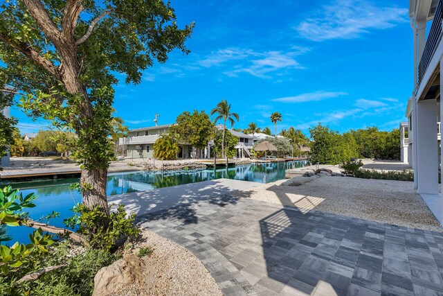 22737 Blackbeard Ln, Cudjoe, FL 33042 - view of swimming pool with a patio area and a water view