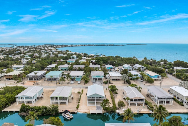 bird's eye view with a water view and a residential view