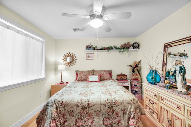 bedroom featuring ceiling fan and light hardwood / wood-style flooring