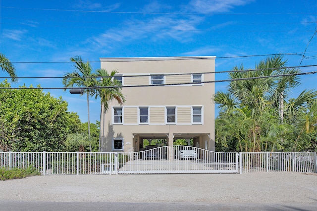 view of front of home with a carport