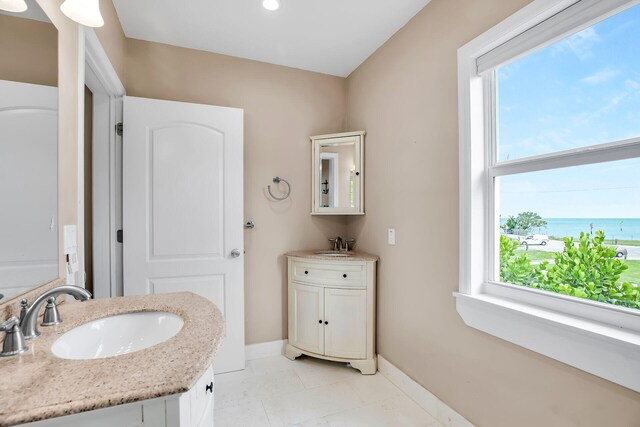 bathroom featuring a water view and vanity