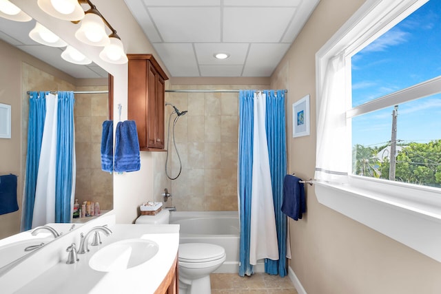 full bathroom featuring shower / tub combo with curtain, vanity, tile patterned flooring, and toilet