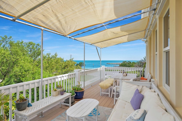 wooden deck featuring a water view