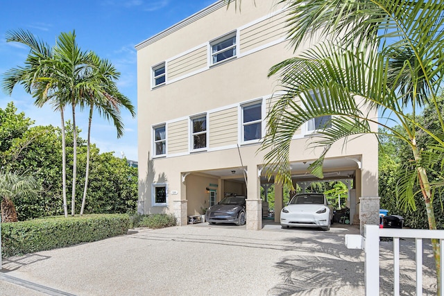 exterior space with a carport